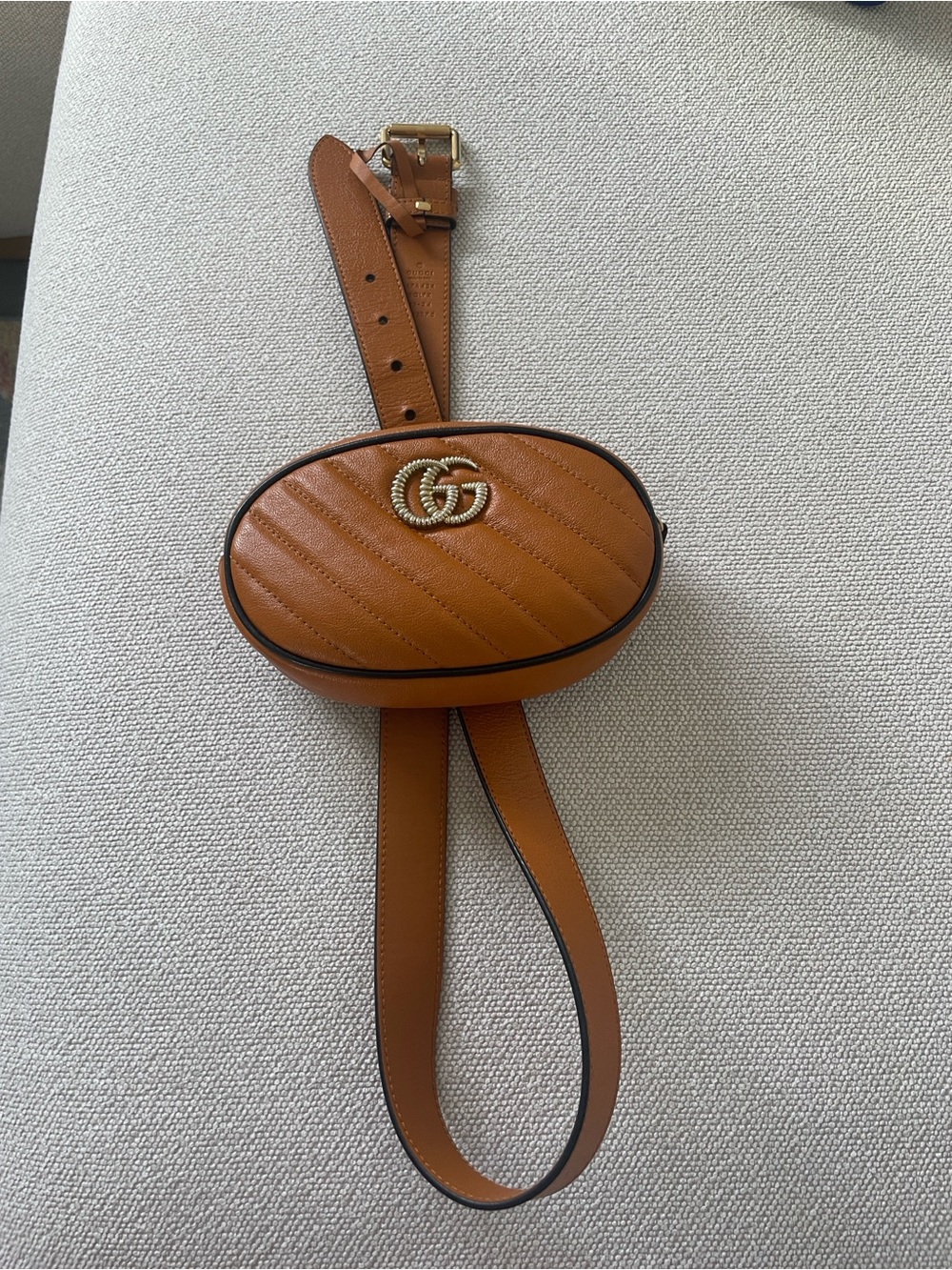 Authentic Gucci GG Quilted Oval Belt Bag in Tan! Used in good condition!